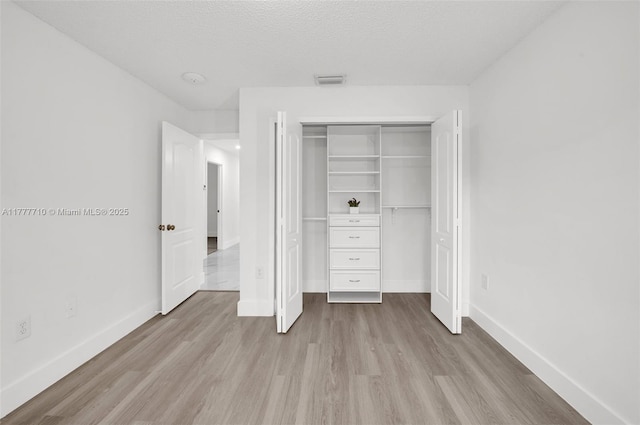 17663 SW 5th St, Pembroke Pines, FL 33029 - unfurnished bedroom featuring baseboards, a closet, wood finished floors, and visible vents