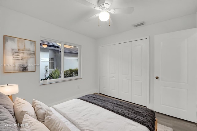 17663 SW 5th St, Pembroke Pines, FL 33029 - bedroom with visible vents, a closet, wood finished floors, baseboards, and ceiling fan