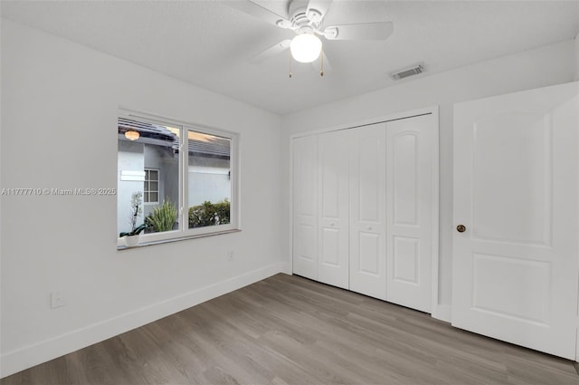 17663 SW 5th St, Pembroke Pines, FL 33029 - unfurnished bedroom featuring baseboards, a closet, wood finished floors, and visible vents