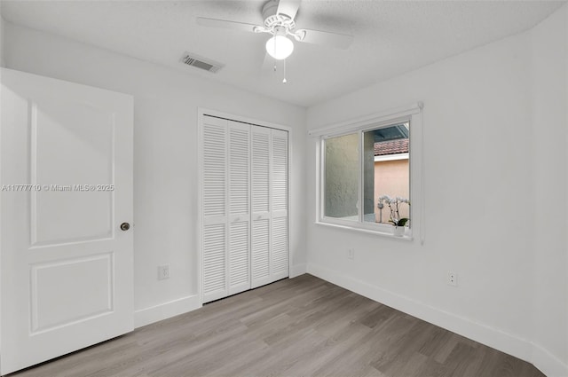 17663 SW 5th St, Pembroke Pines, FL 33029 - unfurnished bedroom with ceiling fan, visible vents, light wood-type flooring, baseboards, and a closet