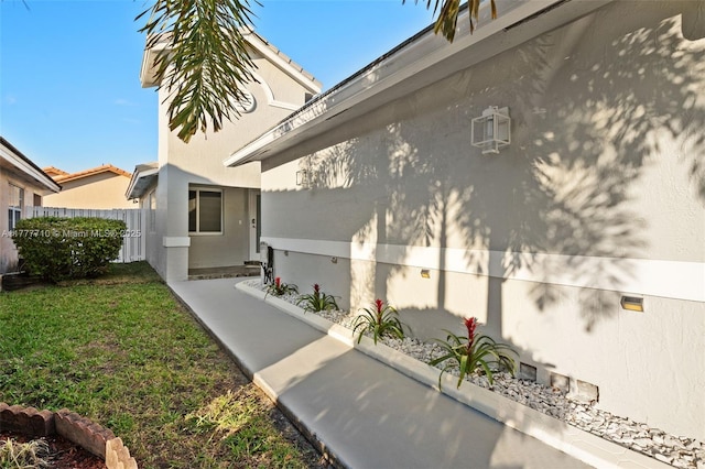 17663 SW 5th St, Pembroke Pines, FL 33029 - view of side of home featuring a yard, fence, and stucco siding