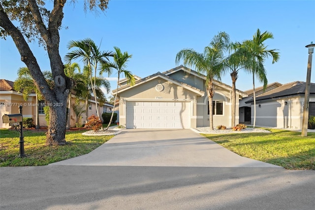 17663 SW 5th St, Pembroke Pines, FL 33029 - ranch-style house featuring an attached garage, stucco siding, driveway, and a front lawn