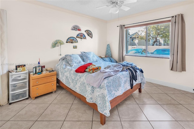 18840 NW 57th Ave Unit 107, Hialeah, FL 33015 - tiled bedroom featuring baseboards, ceiling fan, and ornamental molding