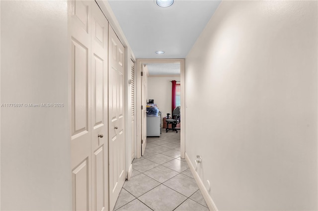 18840 NW 57th Ave Unit 107, Hialeah, FL 33015 - corridor featuring light tile patterned flooring and baseboards