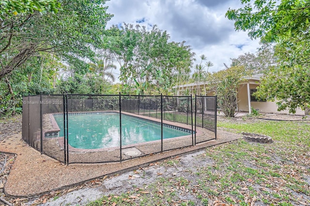 view of pool with a fenced in pool and fence