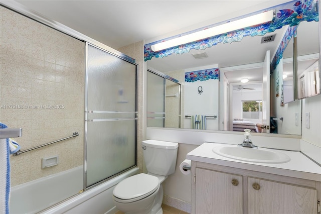 337 Pine Ridge Cir Unit C-1, Green Acres, FL 33463 - full bathroom featuring shower / bath combination with glass door, vanity, visible vents, and toilet