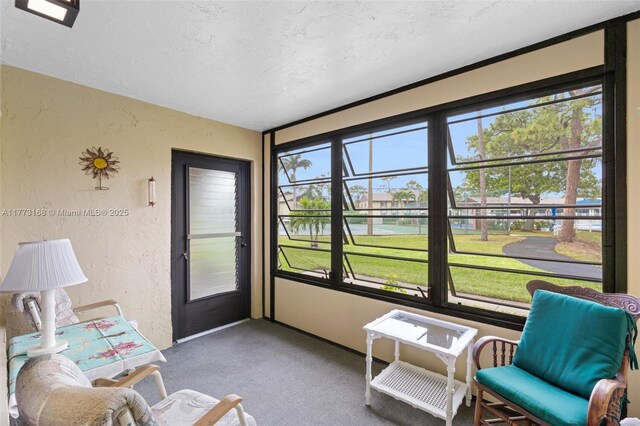 337 Pine Ridge Cir Unit C-1, Green Acres, FL 33463 - living area with tile patterned floors, a paneled ceiling, and bookshelves