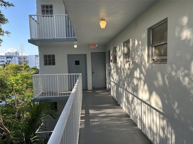 1701 Washington St Unit 404, Hollywood, FL 33020 - doorway to property with a balcony and stucco siding