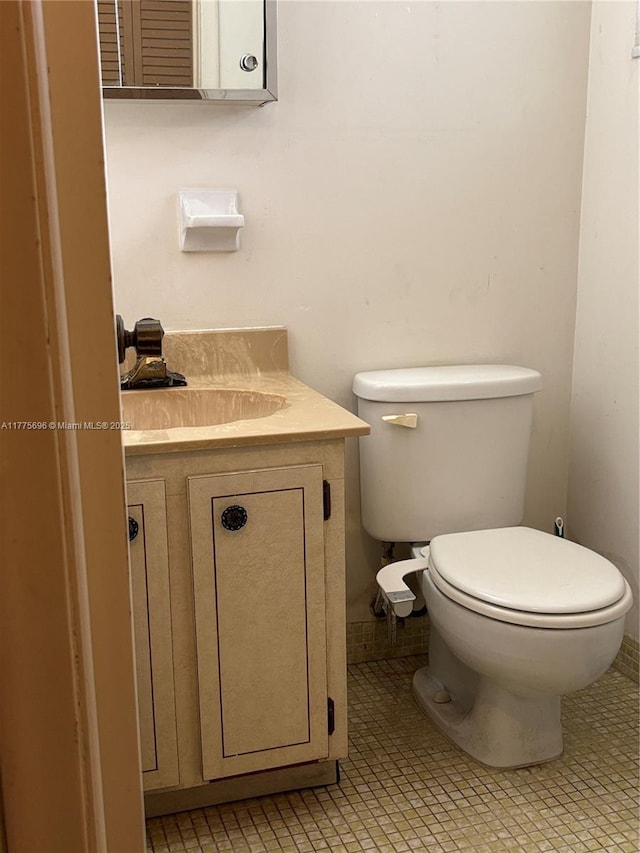 1701 Washington St Unit 404, Hollywood, FL 33020 - half bathroom featuring vanity, toilet, and tile patterned flooring