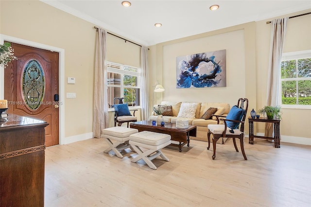 living area with recessed lighting, light wood-type flooring, and baseboards