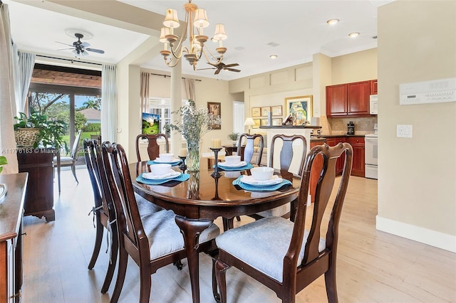 dining area featuring visible vents, baseboards, light wood-type flooring, recessed lighting, and ceiling fan with notable chandelier