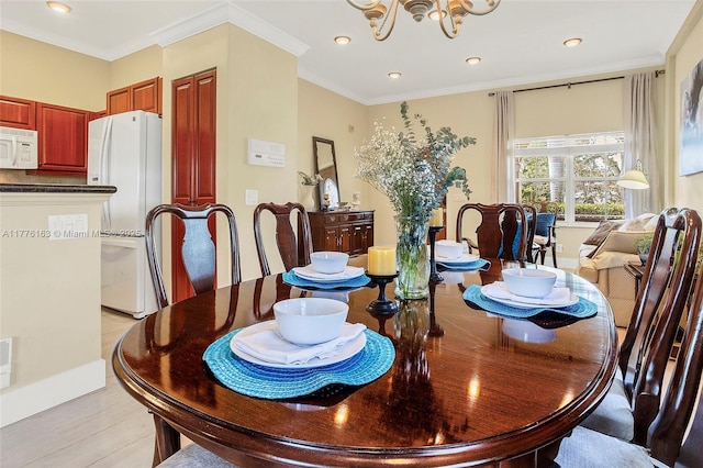 dining space featuring baseboards, a chandelier, light wood-style floors, crown molding, and recessed lighting