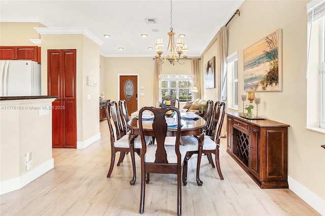 dining room with crown molding, visible vents, recessed lighting, a chandelier, and light wood finished floors