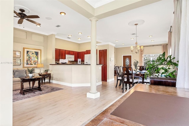 living area featuring ornate columns, ornamental molding, visible vents, and recessed lighting