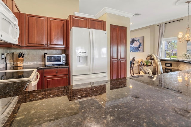 kitchen with ornamental molding, a toaster, white appliances, visible vents, and decorative backsplash