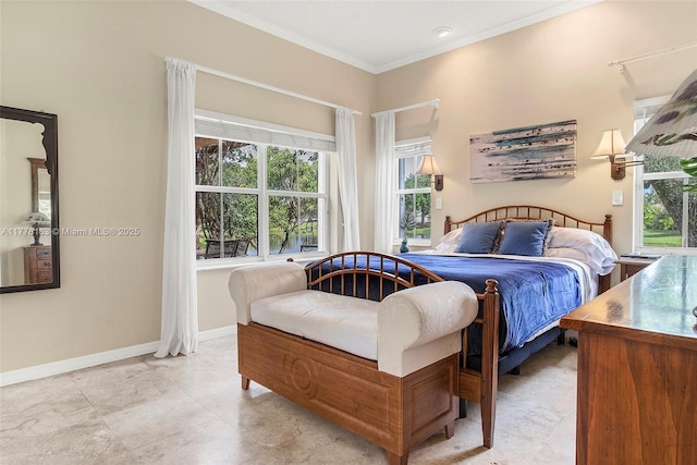 bedroom with ornamental molding, baseboards, and multiple windows