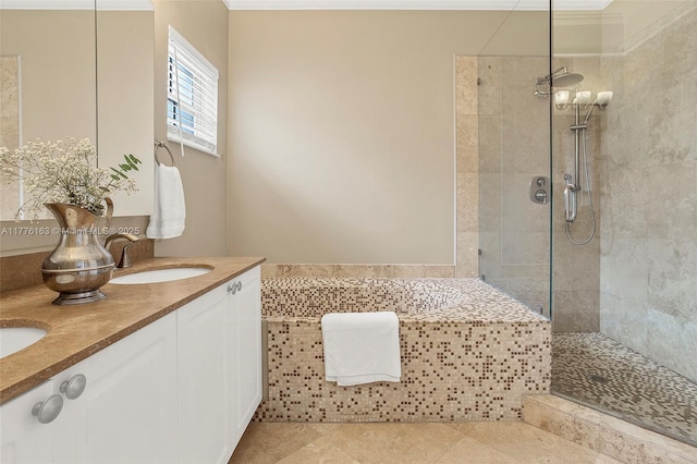 full bath featuring a bath, a sink, a walk in shower, double vanity, and tile patterned flooring