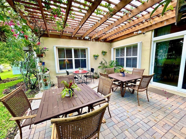 view of patio / terrace featuring outdoor dining space and a pergola