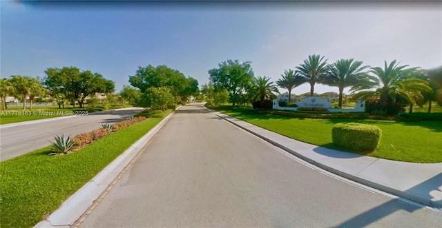 view of street featuring curbs and sidewalks