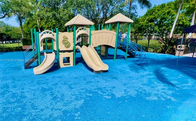 communal playground featuring fence