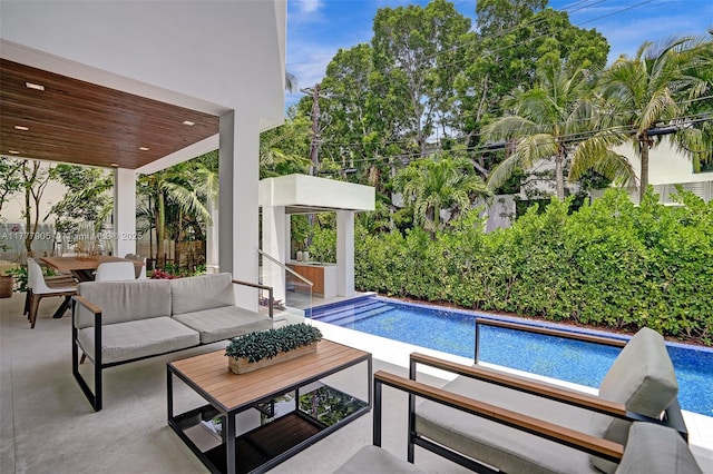 pool featuring a patio area and an outdoor hangout area