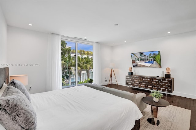 bedroom featuring recessed lighting, baseboards, and wood finished floors