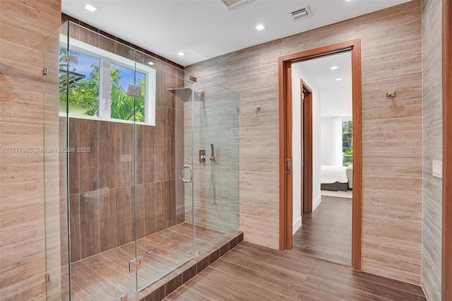 ensuite bathroom with visible vents, a stall shower, ensuite bath, and recessed lighting