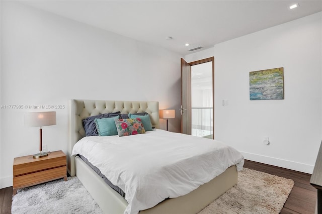 bedroom with recessed lighting, baseboards, visible vents, and wood finished floors