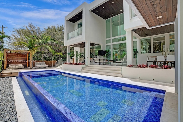 view of pool with a fenced in pool, fence, and a patio