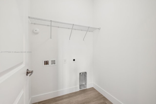 18918 SW 345th Ter, Homestead, FL 33034 - clothes washing area with hookup for an electric dryer, washer hookup, baseboards, wood finished floors, and hookup for a gas dryer