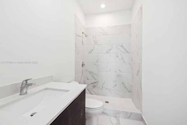 18918 SW 345th Ter, Homestead, FL 33034 - bathroom featuring marble finish floors, a stall shower, toilet, vanity, and recessed lighting