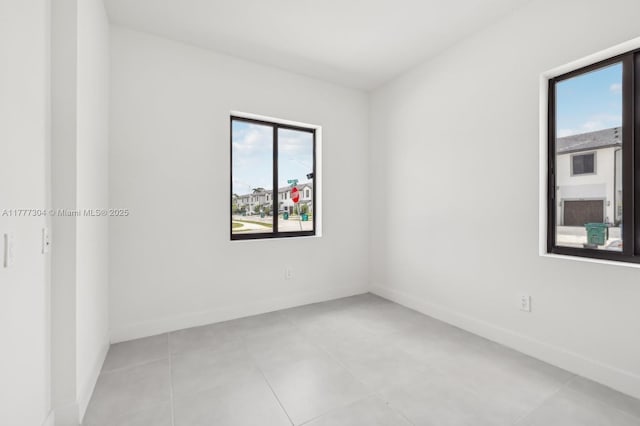 18918 SW 345th Ter, Homestead, FL 33034 - unfurnished room with baseboards and light tile patterned floors