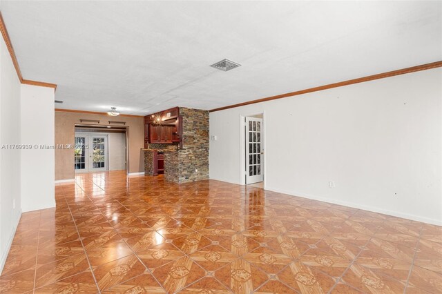 4340 NW 6th St, Plantation, FL 33317 - unfurnished living room with ornamental molding, baseboards, and visible vents