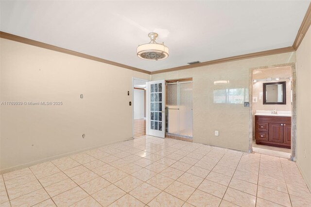 4340 NW 6th St, Plantation, FL 33317 - spare room with visible vents, crown molding, baseboards, a sink, and light tile patterned floors