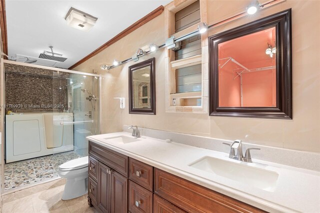 4340 NW 6th St, Plantation, FL 33317 - bathroom with washing machine and clothes dryer, double vanity, a sink, and a stall shower