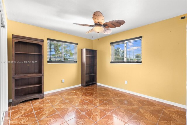 4340 NW 6th St, Plantation, FL 33317 - unfurnished bedroom with a ceiling fan, tile patterned floors, and baseboards