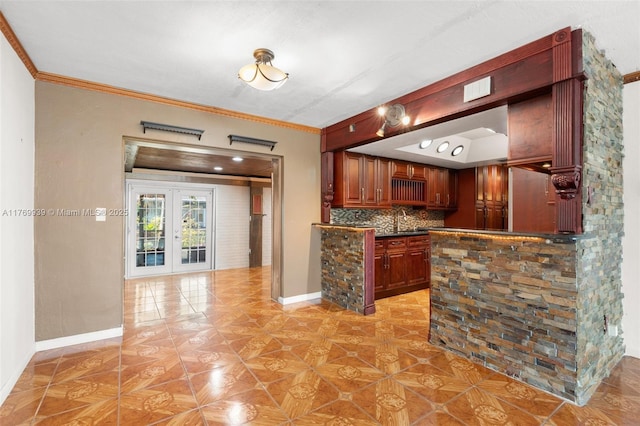 4340 NW 6th St, Plantation, FL 33317 - kitchen with french doors, dark countertops, decorative backsplash, and ornamental molding