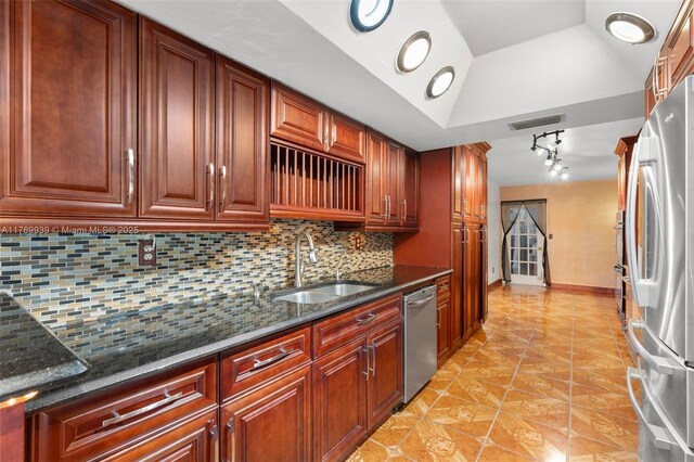 4340 NW 6th St, Plantation, FL 33317 - kitchen with a sink, tasteful backsplash, dark stone countertops, stainless steel appliances, and visible vents