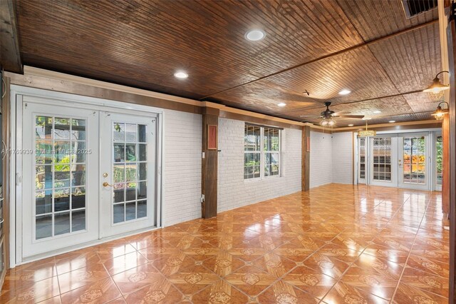 4340 NW 6th St, Plantation, FL 33317 - unfurnished room featuring french doors, wood ceiling, brick wall, visible vents, and ceiling fan