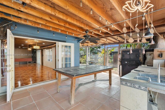 4340 NW 6th St, Plantation, FL 33317 - interior space featuring glass enclosure, an outdoor kitchen, and ceiling fan
