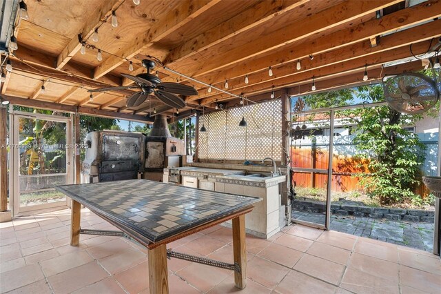 4340 NW 6th St, Plantation, FL 33317 - view of patio / terrace featuring an outdoor kitchen, a sink, fence, and ceiling fan
