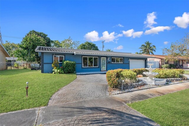 4340 NW 6th St, Plantation, FL 33317 - single story home with stucco siding, fence, decorative driveway, a front yard, and a garage