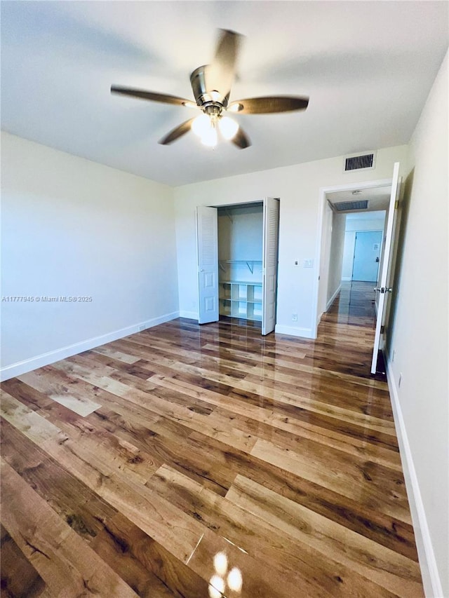 13250 SW 4th Ct Unit 405G, Pembroke Pines, FL 33027 - unfurnished bedroom featuring wood finished floors, a closet, and ceiling fan