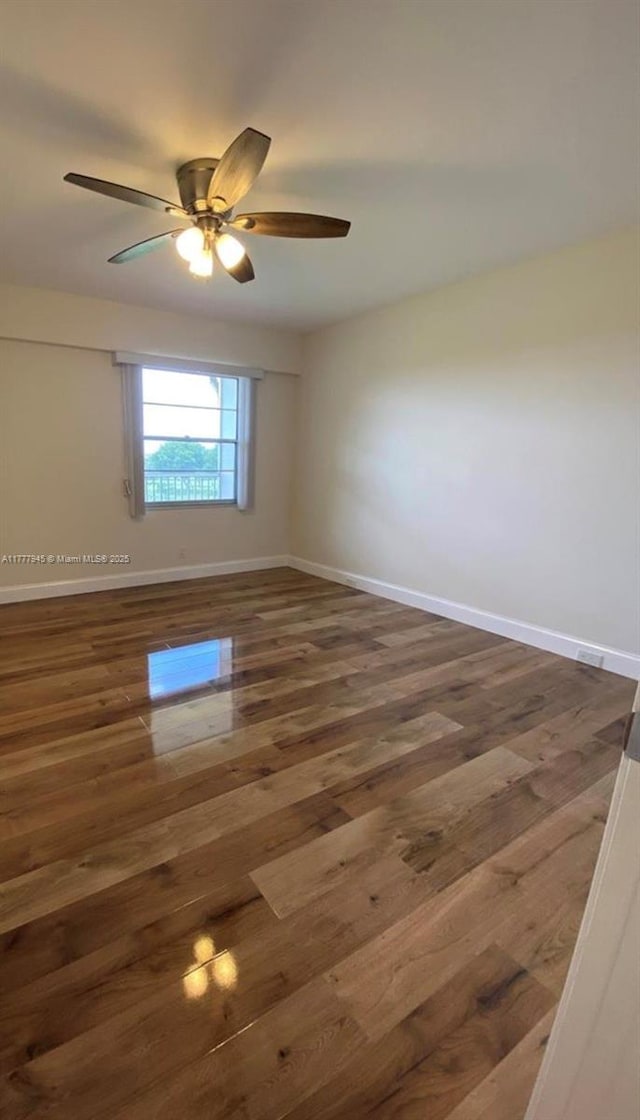 13250 SW 4th Ct Unit 405G, Pembroke Pines, FL 33027 - unfurnished room with wood finished floors and ceiling fan