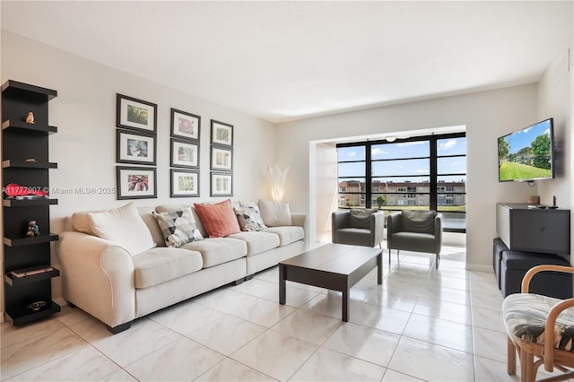 living area with light tile patterned floors