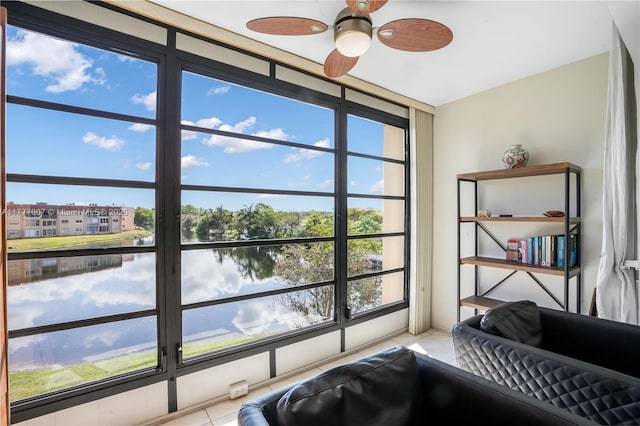 details with a ceiling fan and a water view