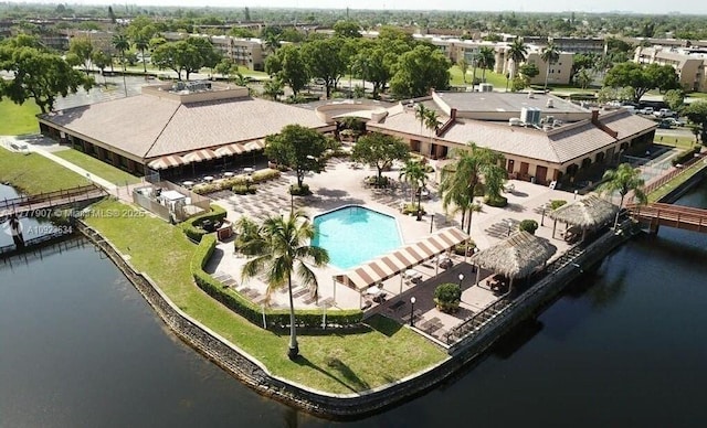 birds eye view of property with a water view