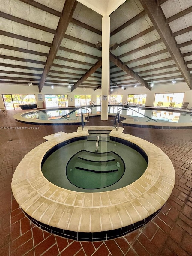 interior details featuring beamed ceiling and a pool