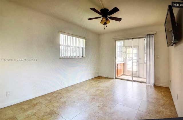 21 Saxony A 21, Delray Beach, FL 33446 - unfurnished room featuring ceiling fan, tile patterned floors, and baseboards