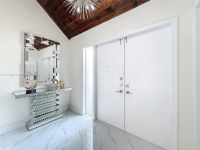 entrance foyer featuring wooden ceiling, marble finish floor, and baseboards